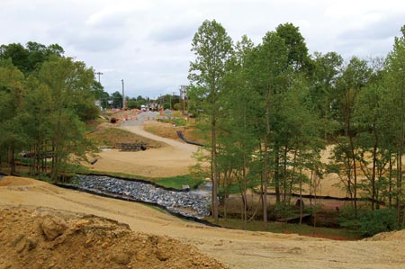 Erosion control measures and traffic barricades are in place in the early stages of Sharpe Bros. and V&Gs Hartley Drive Extension project. (Photo by John Riley, Jr.)
