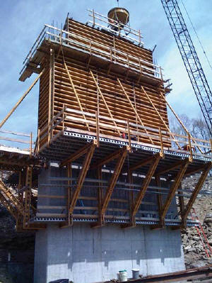 A V&G structure crew pours concrete for a Rte-19 Bypass Bridge in Beckley, WV, part of a $20-million, four-lane highway project.