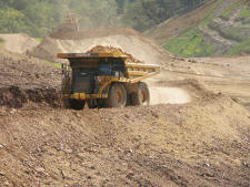 Haul Truck Operator Darcy Young supplies material for a fill bench. (Photo by Carl Thiemann)